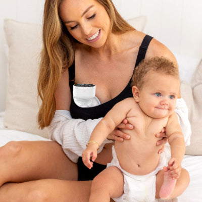 tire-lait-electrique-adi-blanc-maman-repos-bebe-joue